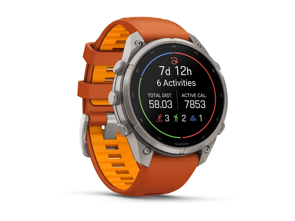 Garmin Fenix 9 Pro inReach 47 mm, титан, оранжевый силиконовый ремешок — вид сбоку