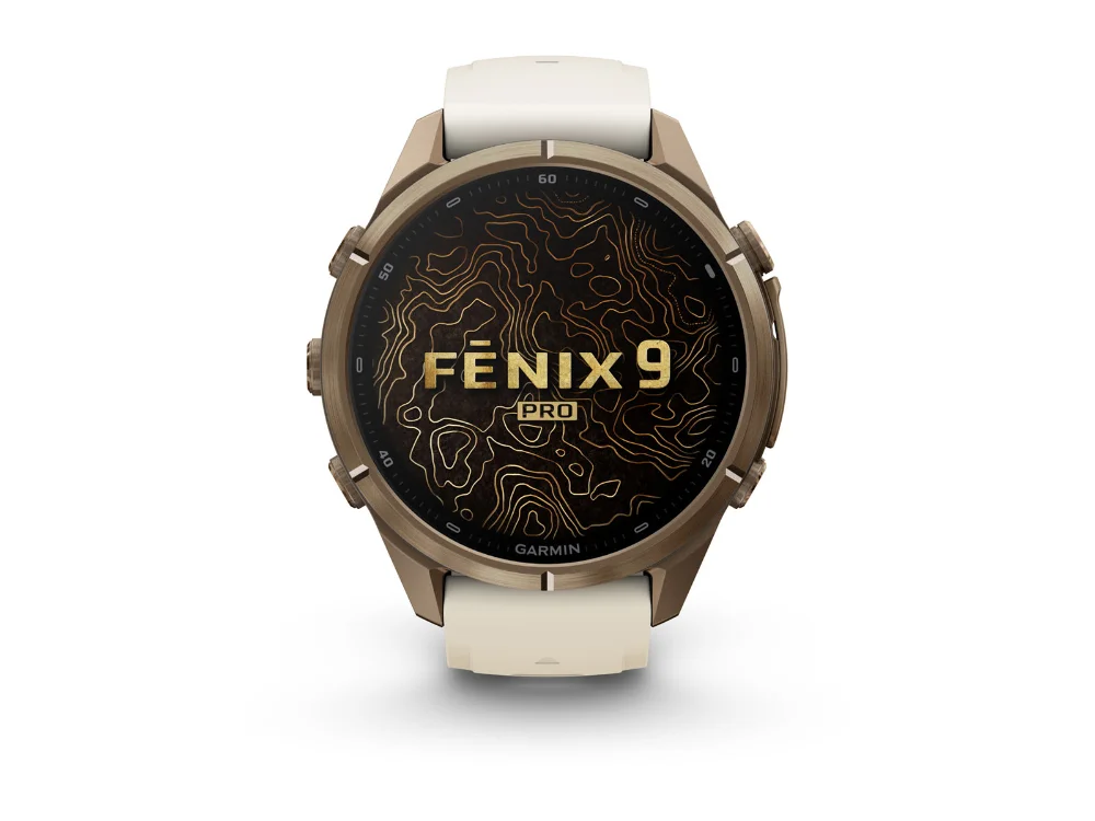 Garmin Fenix 9 Pro 43 mm, золотистый титан, кремовый/серый силиконовый ремешок — вид спереди
